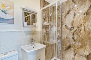 a bathroom with a shower and a toilet and a sink at 3 Bed in Belford oc-79178 in Belford +34 photos