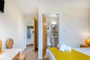 a bedroom with a bed and a bathroom at 3 Bed in Belford oc-79178 in Belford