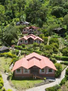an aerial view of a house with an orange roof at Monte Selva Hotel Spa Termal in Baños