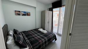 a bedroom with a bed with two cups on it at Bella Luxury Suite III in Paralia Katerinis