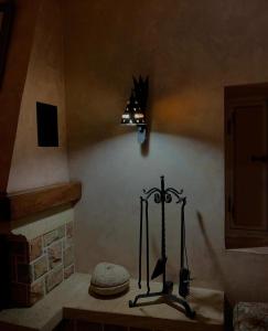 a room with a fireplace and a lamp on the wall at Menzel Yahia in Houmt Souk