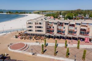 an aerial view of a hotel and a beach at Strandappartement Iselmar Makkum nr 30 in Makkum