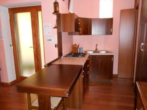 a kitchen with a sink and a counter top at I QuattroGioielli in SantʼAngelo le Fratte