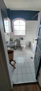 a bathroom with a sink and a toilet and a window at Hospedaje por 7 días 15 dias o Mes in La Serena +50 photos