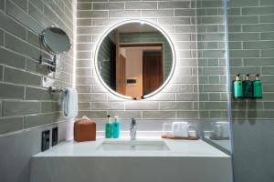 a bathroom with a sink and a mirror at Ambulan Mexico City in Mexico City +49 photos