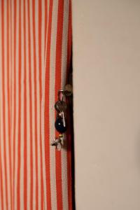 a close up of a red and white striped tie at Casa Tota in Assomada +6 photos