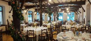 a banquet hall with white tables and chairs at Hostal Ayestaran I in Lekunberri