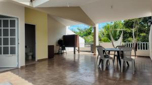 a dining room with a table and chairs at Landing View 204 with private rooftop terrace in Rincon