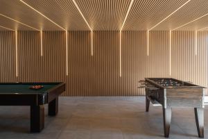 two billards in a room with a pool table at Recanto de Passos - Amarante in Amarante