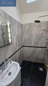 a bathroom with a sink and a shower at The Summer House in Saint Mawes +40 photos