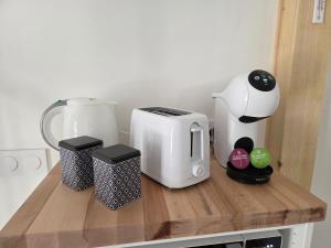 a counter with a coffee maker and a blender on it at Nuit douce au LYS in Phalsbourg