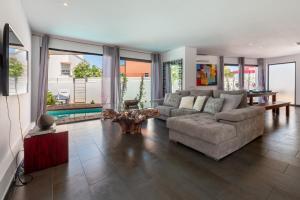 a living room with a couch and a table at Can Olivera in Nuestra Señora de Jesus