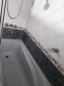 a white bath tub in a bathroom at Casa Fauna in Mendiolaza +21 photos