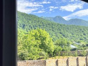 a view of a mountain from a window at Mountain View Deluxe Villa & pool in Gabala