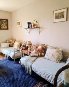 a living room with two couches and a couch at Studniska Country Estate in Studniska