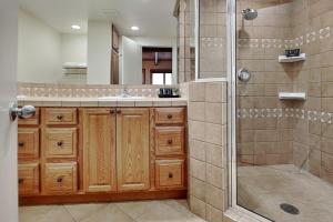 a bathroom with a shower and a sink and a mirror at Timberline Condominiums 3 Bedroom Deluxe Unit D2E in Snowmass Village +20 photos
