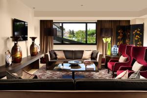 a living room with a couch and a table at A.Roma Lifestyle Hotel in Rome
