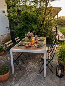 a white table with plates of food on it at Country House in Sozopoli