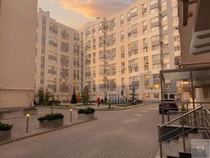 a large apartment building with a street in front of it at RentHouse Apartments Premium Living in Chişinău