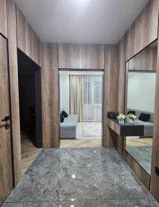 a living room with a couch and a table at Бауржан Момушелы 28 in Fëdorovka