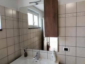 a bathroom with a sink and a mirror at Villetta da Amare in Imperia +71 photos