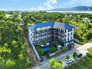 an aerial view of a building with a blue roof at Sea Angel Hotel Halong in Ha Long