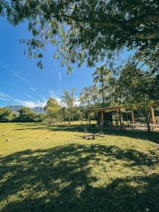a park with a pavilion in the middle of a field at Camping Rio do Rastro in Lauro Müller