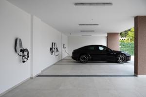 a black car is parked in a garage at Diamond2 Hotel in Zagreb