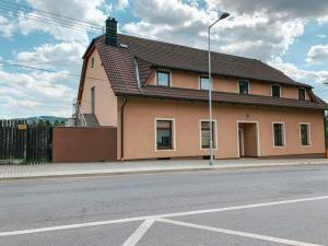 a house on the side of a street at Penzion Leona in Obecnice