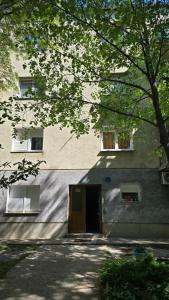 a building with a door and two windows on it at Apartman NIKOL in Senj