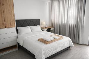 a bedroom with a bed with two towels on it at Costanera Hotel in San Juan