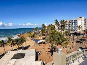 a view of a beach with palm trees and the ocean at Rondevoux 17 in Margate