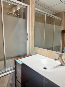 a bathroom with a sink and a shower at Suitte Catalunya in Calafell +25 photos