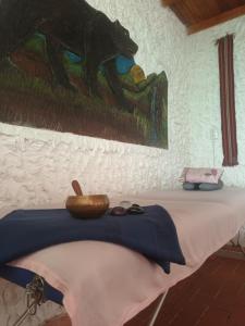a table with a bowl on top of it at Villa Jucumarini in Coroico