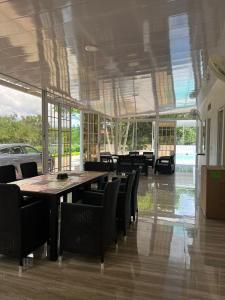 a large dining room with a table and chairs at Finca Nirvana. in Agua de Dios