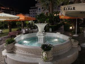 a large fountain in the middle of a courtyard at Hotel Villa Megi in Golem