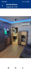 a picture of a bedroom with a bed and a television at Noclegi Bielawa in Bielawa +20 photos