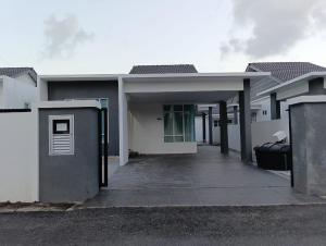 a large white house with a driveway at SD Homestay in Bachok