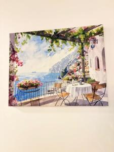 a painting of a table with a view of the ocean at Eon 2 - Apartamento en edificio con piscina in Estación Pamplona