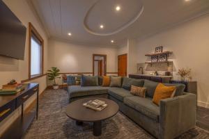a living room with a couch and a table at The Promissory Hotel in Roanoke