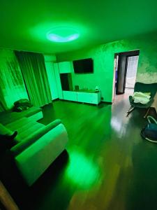 a living room with a couch and a tv at Apartament CC in Drobeta-Turnu Severin