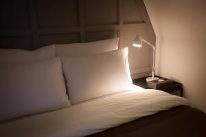 Postel nebo postele na pokoji v ubytování Hotel Gaden