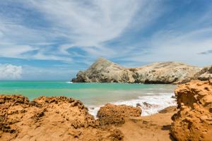 a view of a beach with rocks and the ocean at Hotel Waya Guajira By OxoHotel in Albania