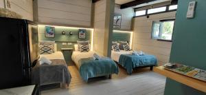 a room with four beds in a room at Villa Palma in Marbella