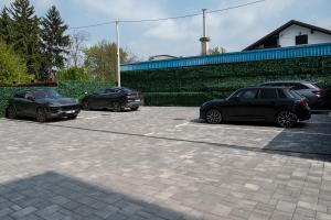 a group of three cars parked in a parking lot at Diamond2 Hotel in Zagreb