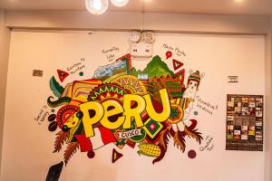 a wall with the word peru painted on it at Magic Packer Hostel in Cusco