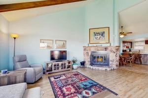 a living room with a couch and a fireplace at Aspenwood 4229-30 in Pagosa Springs