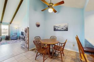 a dining room with a ceiling fan and a table at Aspenwood 4229-30 in Pagosa Springs