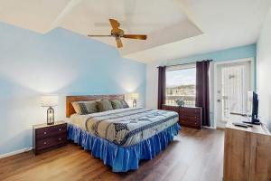 a bedroom with a bed and a ceiling fan at Aspenwood 4229-30 in Pagosa Springs