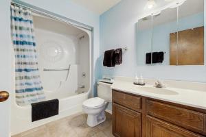 a bathroom with a sink and a toilet and a shower at Aspenwood 4229-30 in Pagosa Springs +17 photos